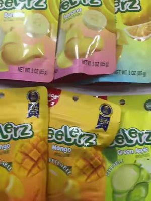 TikTok post by @_c.hlo.e_ for Amos Sweets. Caption reads: @Amos Sweets #amosgummies #amospeelerz #candy....