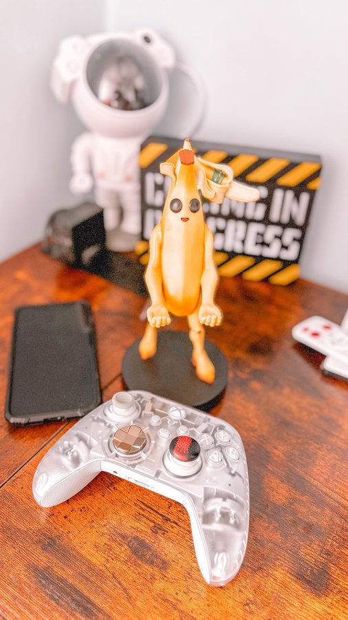 Instagram post by @just_a_mummy_of_two_ for EXG Pro. Caption reads: [...] Fortnite phone & controller holder from EXG....