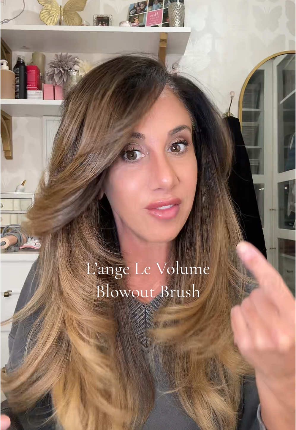 TikTok post by @daniella_britt for L’ange Hair. Caption reads: [...] Brush EVER!!! It’s the @langehair Le Volume....