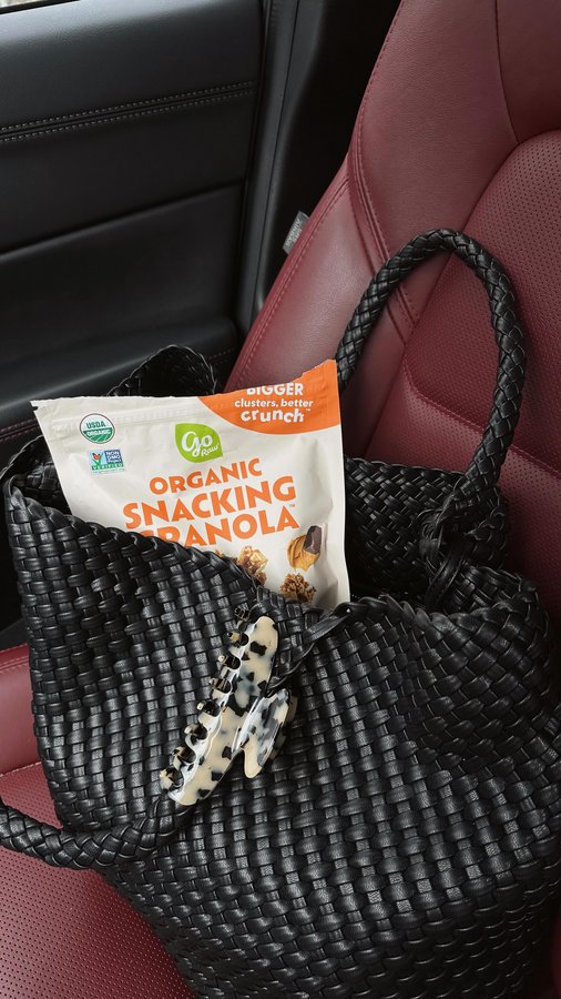 Instagram post by @caitlindechiara for Go Raw. Caption reads: Snacks are a non-negotiable as a mom!!! This....