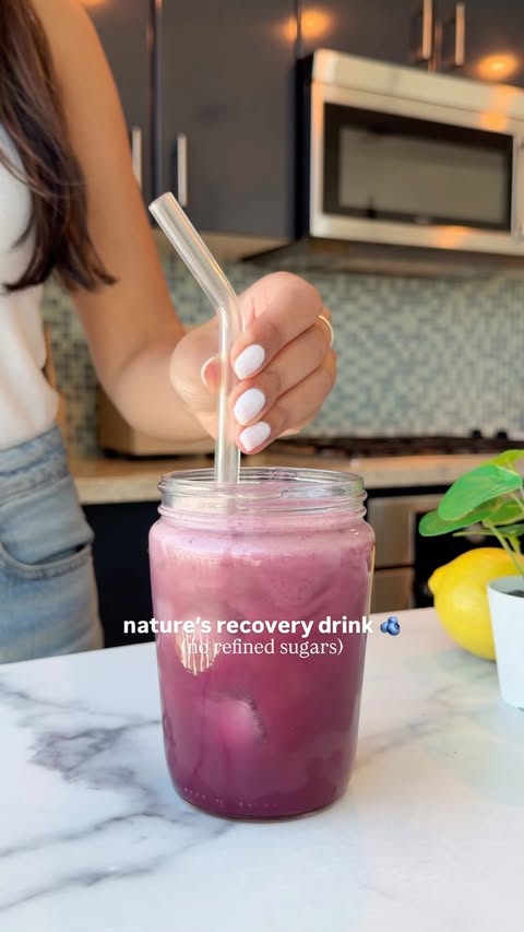 Instagram post by @wakeupandkale for doTERRA Essential Oils USA. Caption reads: nature’s recovery drink recipe below 🫐🍋🥥 # ad....