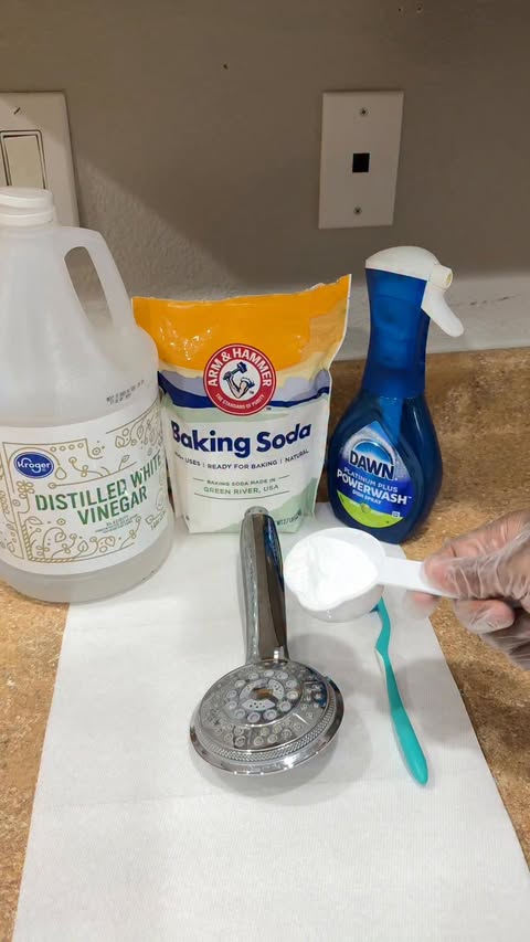 Instagram post by @its_ekcho for ARM and HAMMER. Caption reads: Shower head looking a little crusty? 😭 Baking....