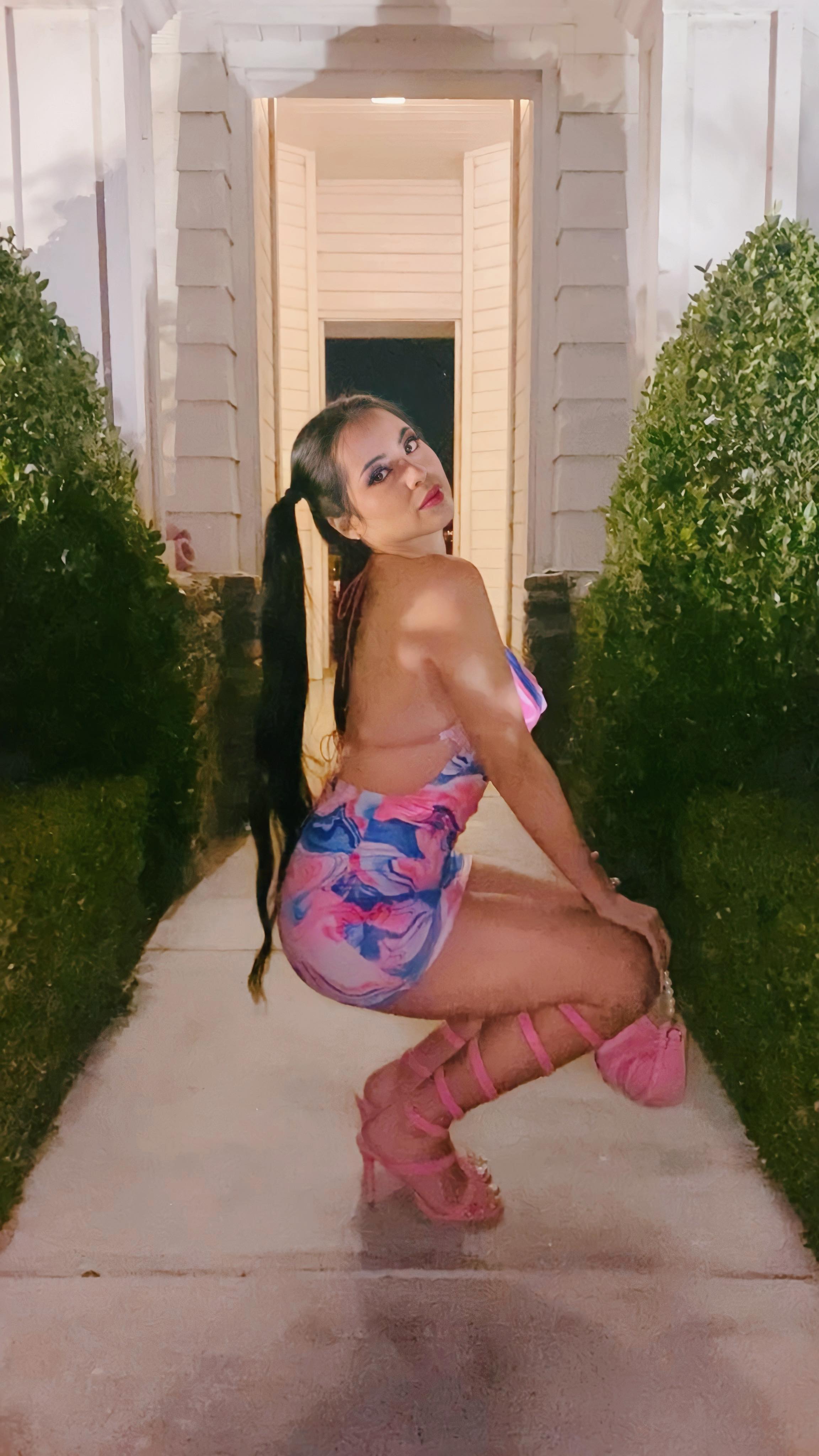 Instagram post by @kittykatlo for AMICLUBWEAR. Caption reads: [...] red lace gloves, and pearl purse from....