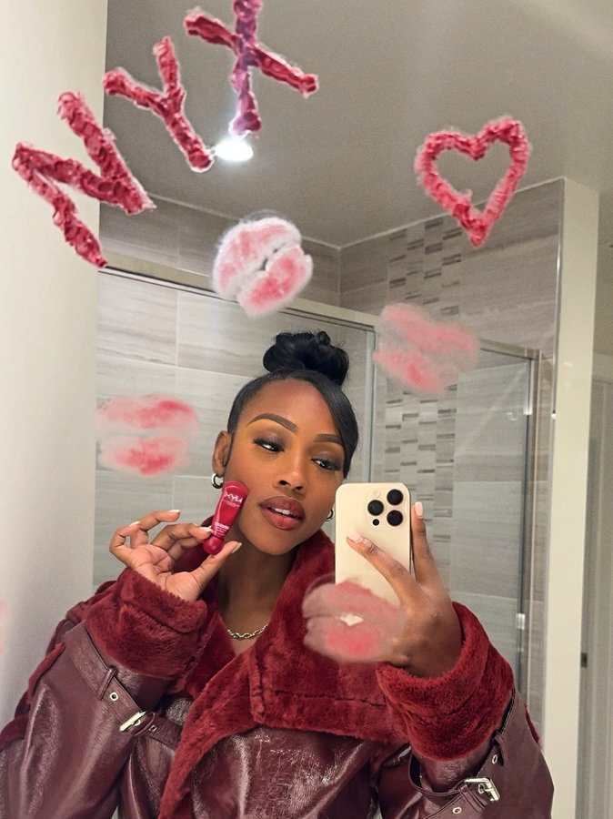 Instagram post by @caittheegreat__ for NYX Cosmetics. Caption reads: #NYXCosmeticsPartnerGlossy gifts that sleigh....