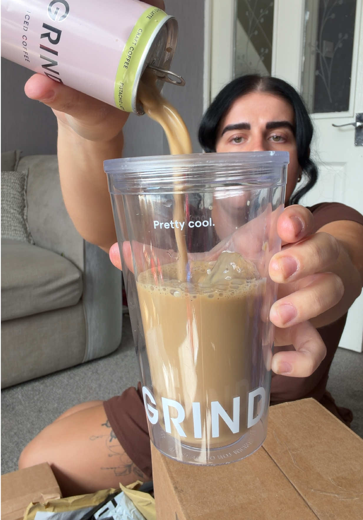TikTok post by @emmafayedocherty for Grind. Caption reads: Grind pistachio iced latte cans getting me [...].