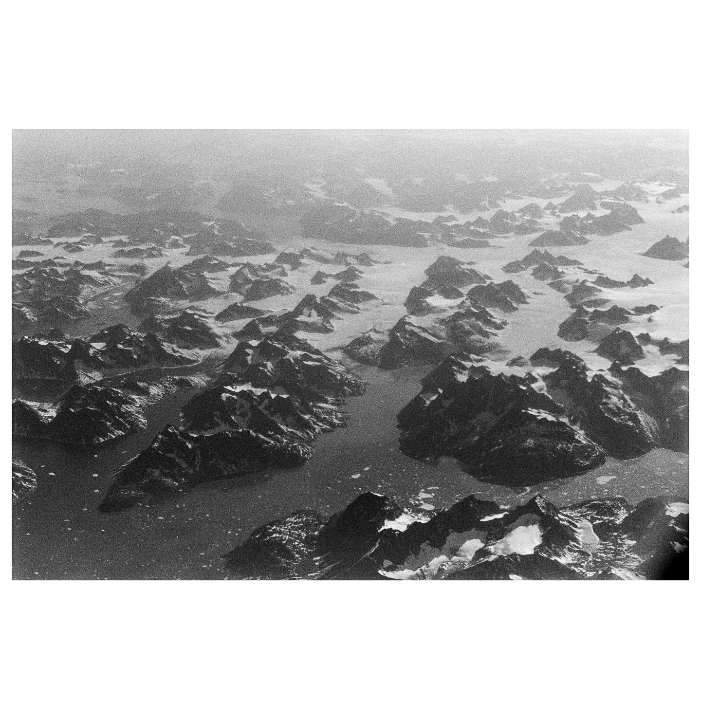 Instagram post by @mountainsonfilm for Kodak. Caption reads: [...] roll of Tri-X; somewhere over Greenland....