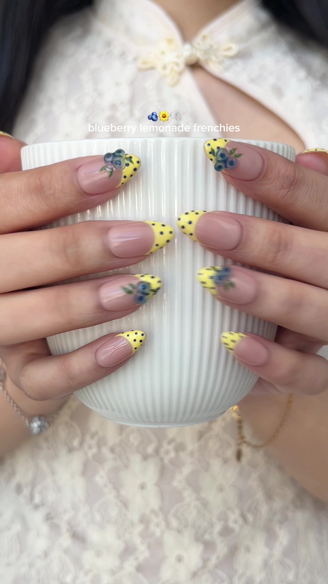 TikTok post by @h0neybuttercups for Ersa Nails. Caption reads: @Ersa Nails blueberry and butter yellow polka dots....