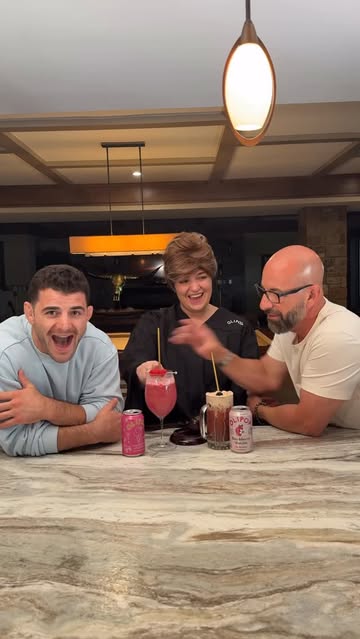Instagram post by @johnnydrinks_ for OLIPOP. Caption reads: [...] Johnny v. Dad! 🍓 🫐 @drinkolipop....