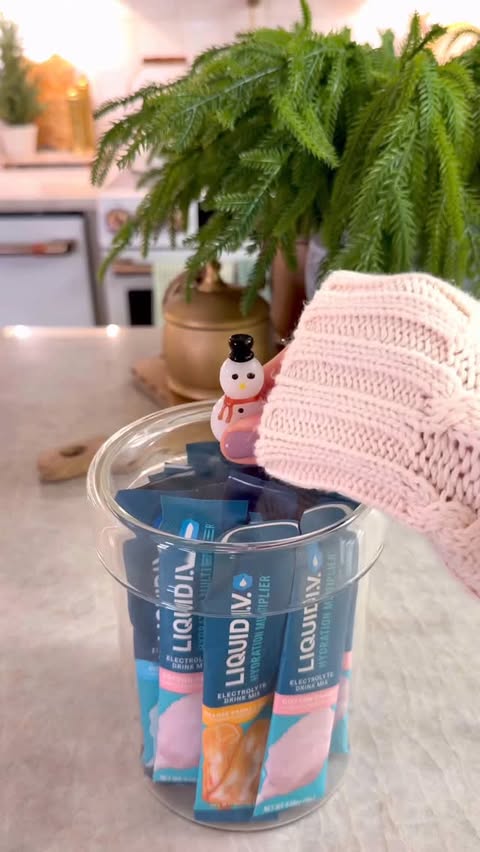 Instagram post by @organizewithrosie for Liquid IV. Caption reads: Holiday prep mode: activated 🎄✨
Restocking my....