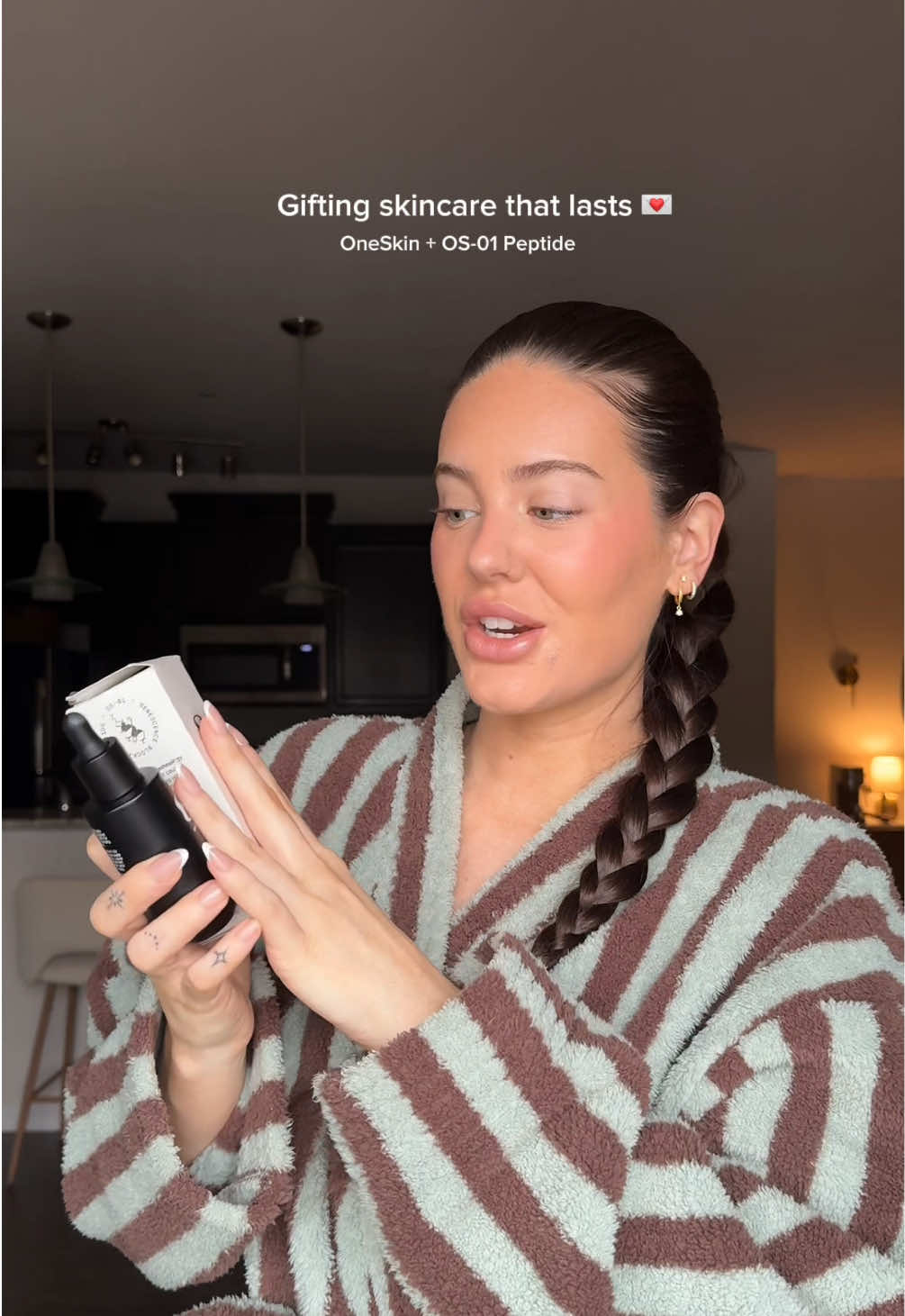 TikTok post by @abigailgherring for OneSkin. Caption reads: Gifting healthy skin for the long run this year....