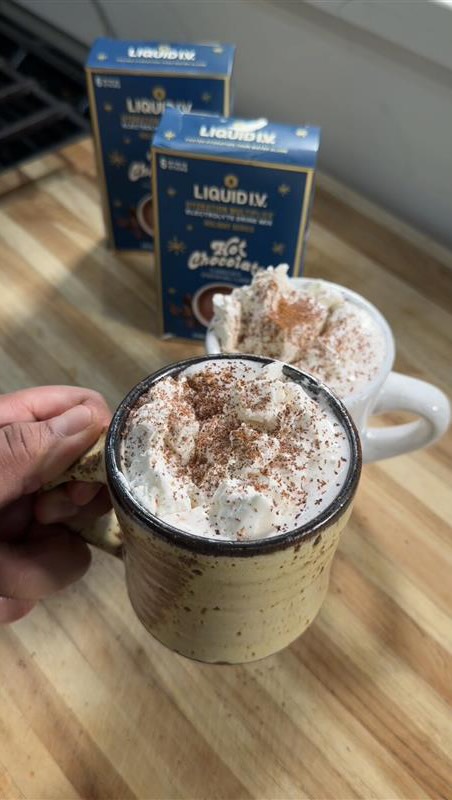 Instagram post by @hrnaeatz for Liquid IV. Caption reads: Recipe ⤵️ Quick & Hydrating hot chocolate with....