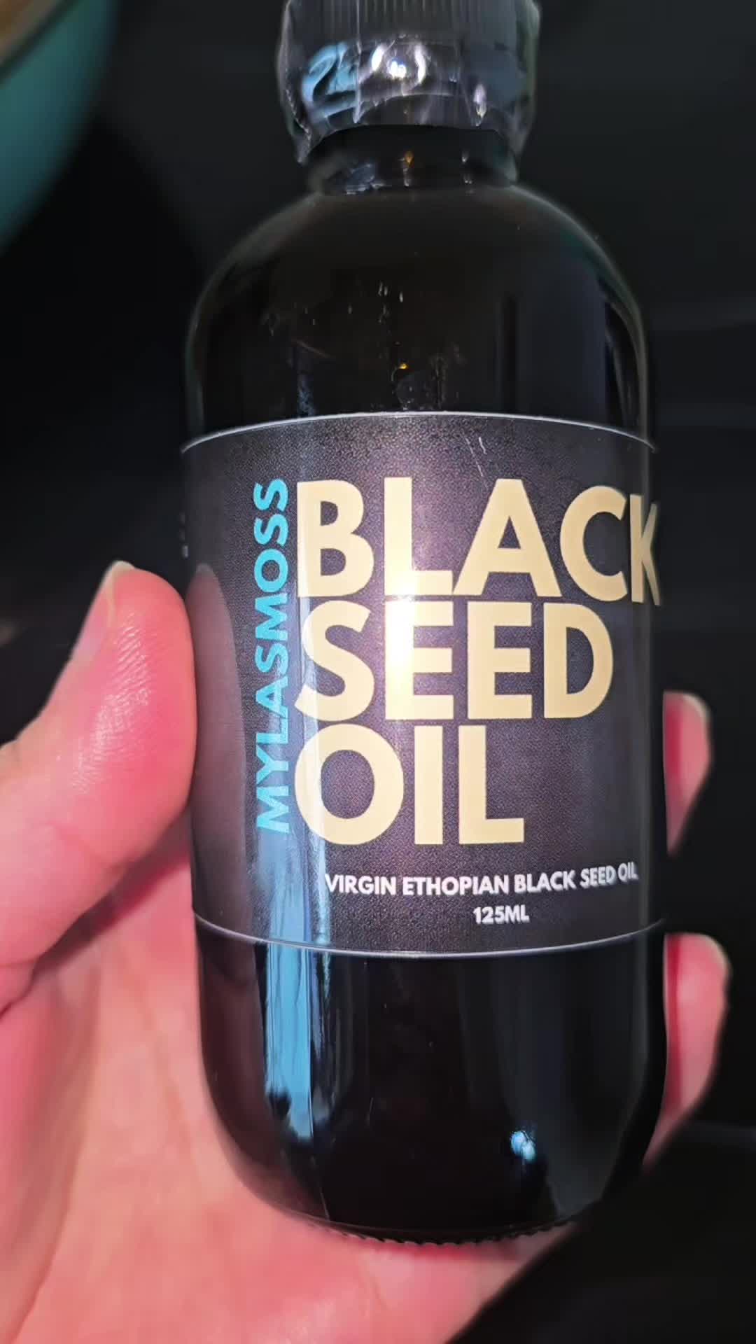 TikTok post by @sylheti_boin for Myla's Moss. Caption reads: Virgin Ethiopian Black Seed Oil @MYLASMOSS. 100%....