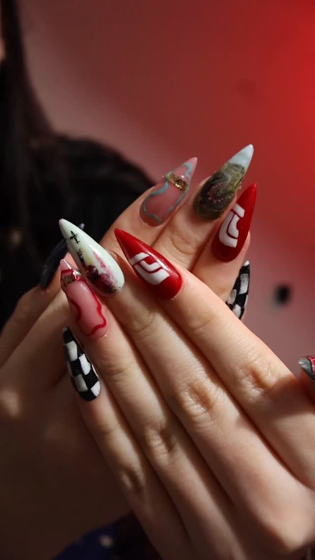 Instagram post by @nettielombardimua for FORMULA 1. Caption reads: F1 Nails @f1 @f1academy #f1 #f1nails #nails....