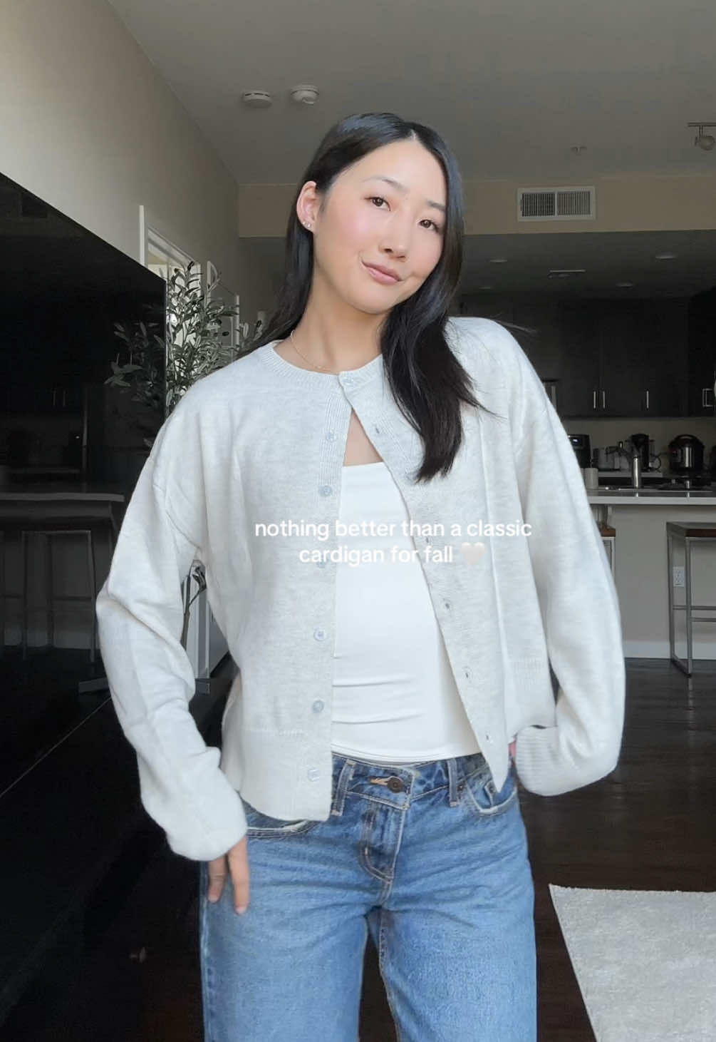 TikTok post by @krisis.tan for Automet. Caption reads: @AUTOMET 🤍 #cozycardigan #cardiganoutfit....