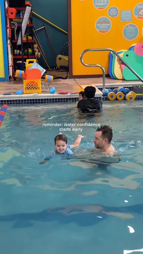 Instagram post by @themodernlatinamama for Goldfish Swim School. Caption reads: [...] can do for your little one. 💙 -....
