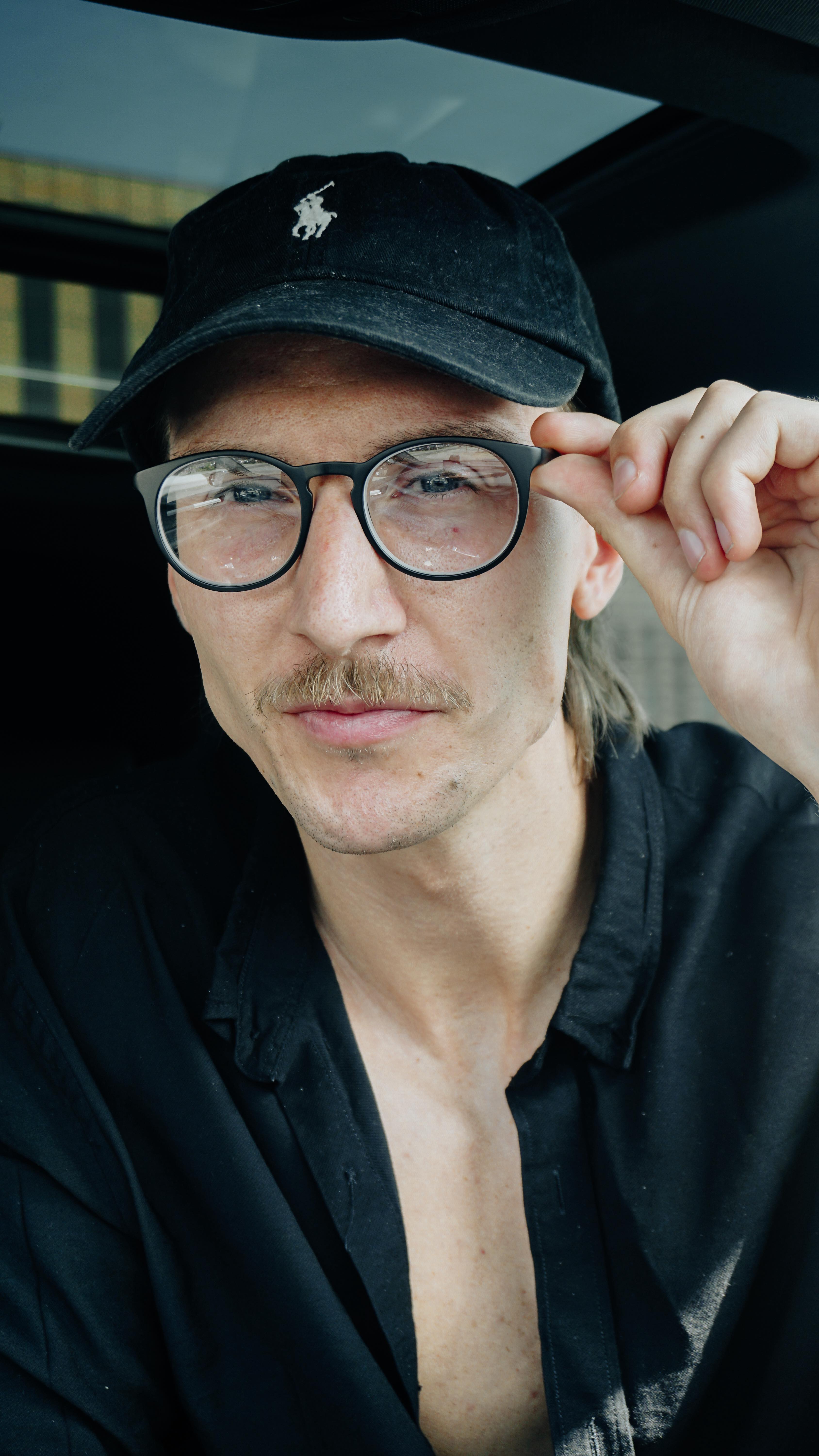 Instagram post by @kevinlukarski for SmartBuyGlasses. Caption reads: [...] drives to sunny days. 

With my....