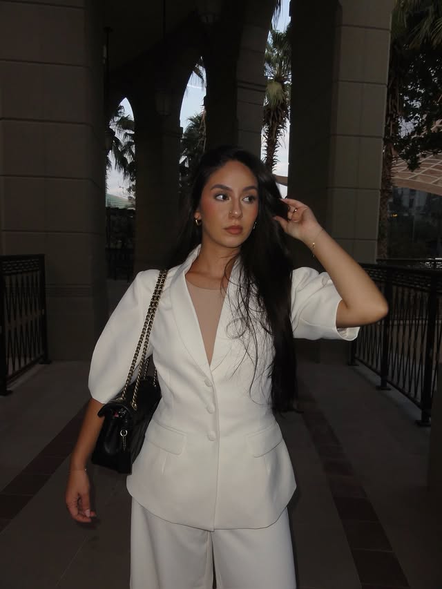 Instagram post by @leyagkyy for Meshki. Caption reads: white suit by @meshki 🫖 

*gifted #outfit #ootd.