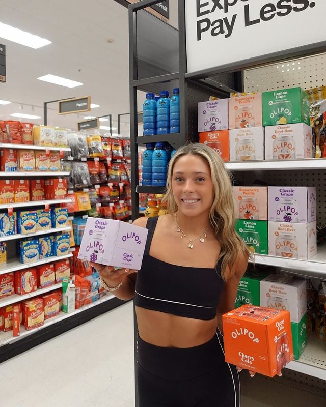 Instagram post by @nicole.king7 for 98Strong. Caption reads: Had to grab my go-to soda @drinkolipop at....