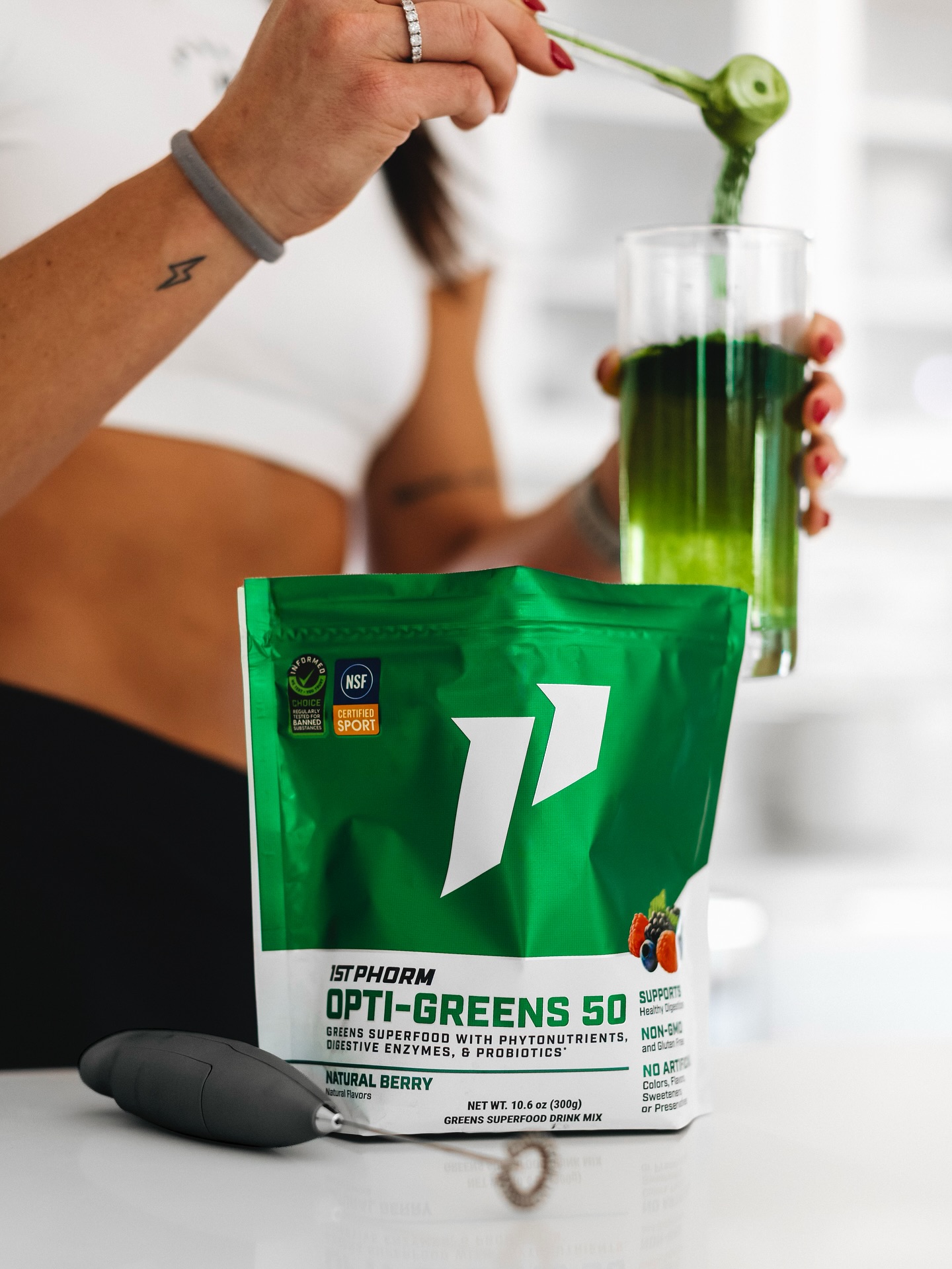 Instagram post by @lexijwellness for 1st Phorm. Caption reads: Greens aren’t very sexy… but drinking them daily....