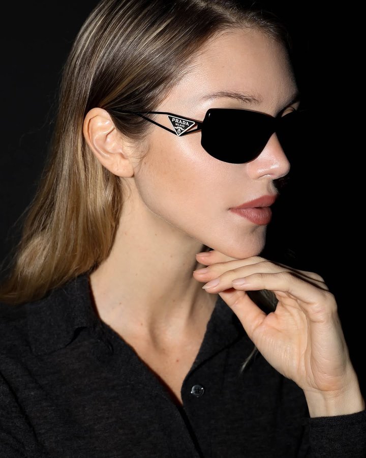 Instagram post by @jessieandrews for EssilorLuxottica. Caption reads: Closing out the new year in my favorite @PRADA....