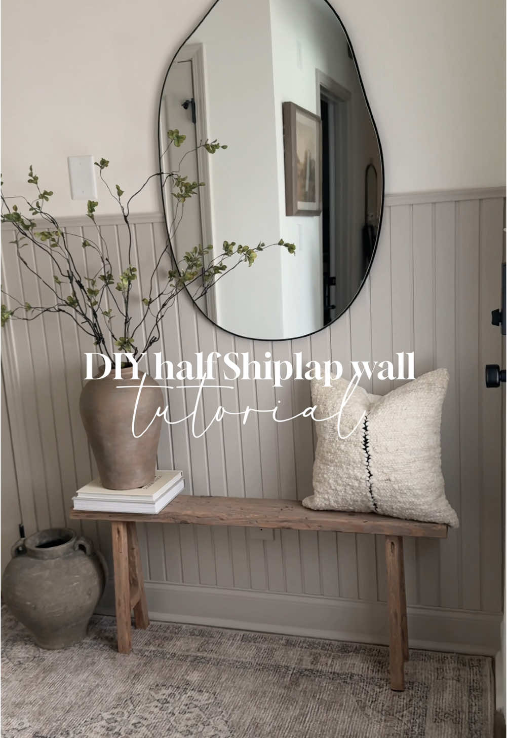 TikTok post by @creatively.crisp for Lowe's. Caption reads: The easiest DIY half Shiplap wall! ✨ I love these....