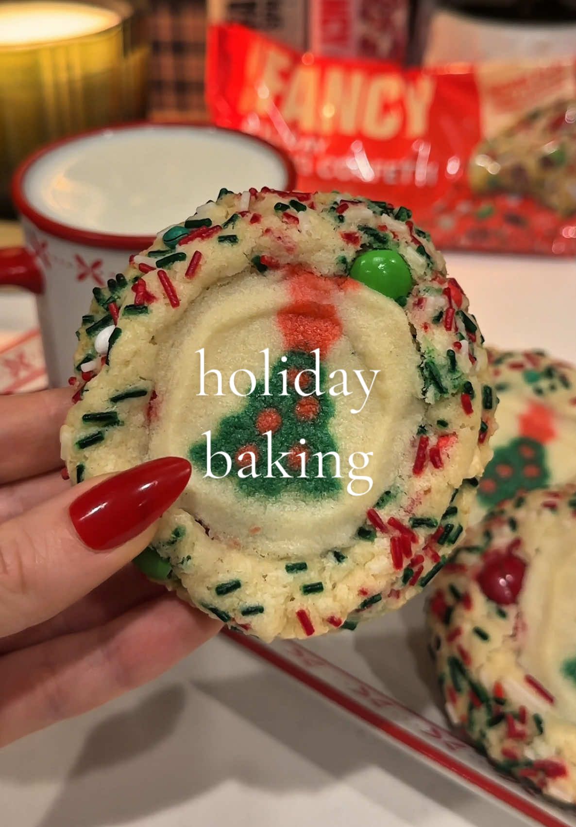 TikTok post by @yevaberez for Fancy Sprinkles. Caption reads: Adding extra joy to the cookies with @Fancy....