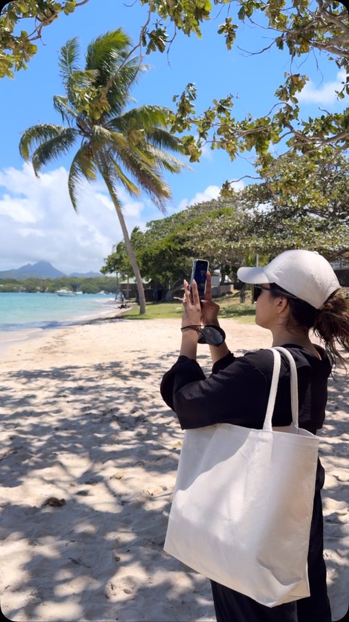 Instagram post by @aparna.das1 for GT Holidays. Caption reads: [...] from the world. 💙 Travel partner :....