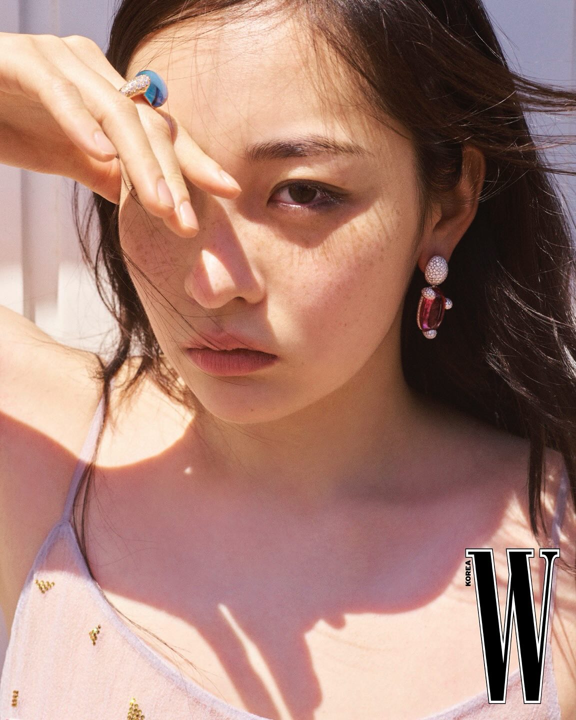 Instagram post by @minhakim__ for Pomellato. Caption reads: Cover for @wkorea with @pomellato 🤍 #ad.