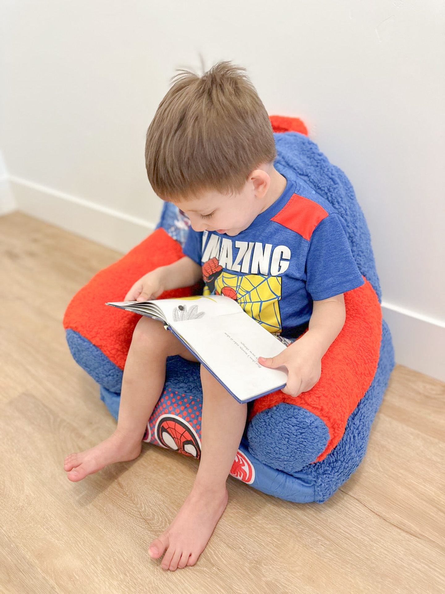 Instagram post by @raysaanjos for Delta Children. Caption reads: This cozy little Spidey chair from @deltachildren....