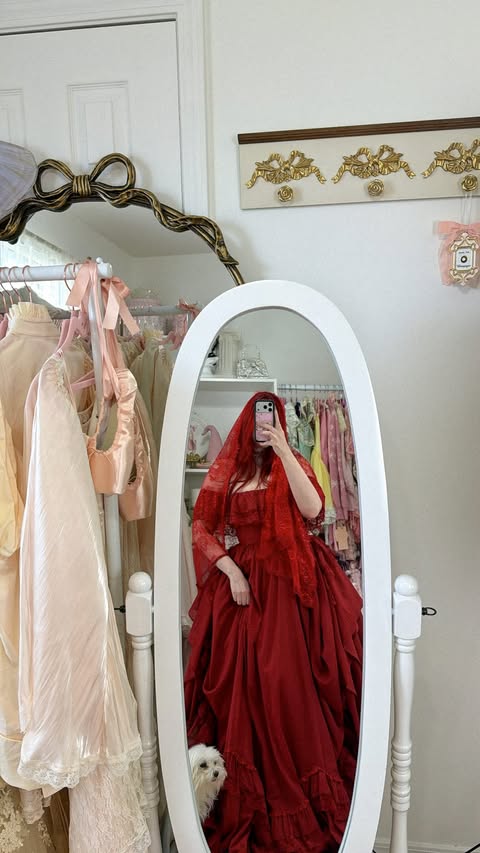Instagram post by @styledfreckles for Selkie. Caption reads: [...] wearing The Blood Red Be Mine Gown by....