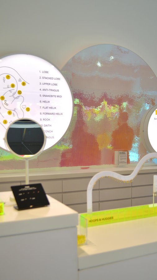 Instagram post by @hydeparkvillage for Studs. Caption reads: Studs is officially open! From expert piercings to....