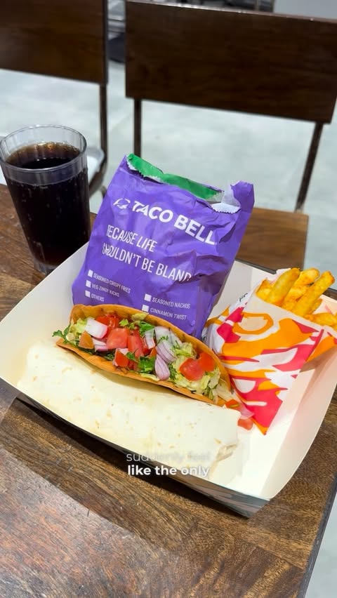 Instagram post by @food_o.clock for Swiggy Dineout. Caption reads: Weekend plans = TACO BELL 🌮✨ Good vibes, cheesy....