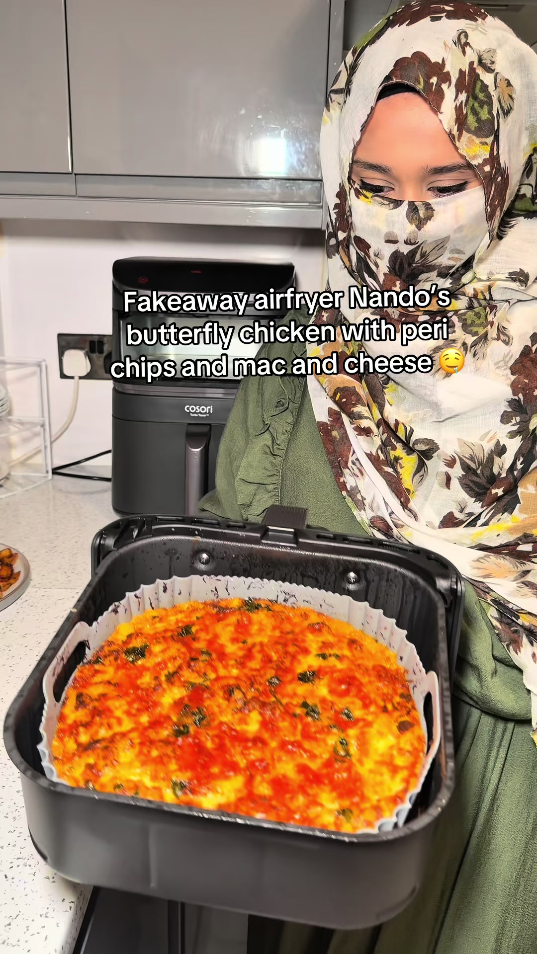 TikTok post by @cookwithes for COSORI. Caption reads: [...] chips & mac and cheese, all done in the....