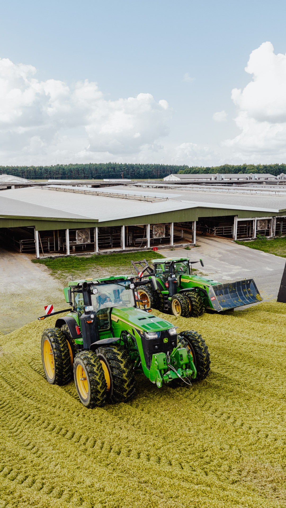 Instagram post by @jp.agrar for John Deere. Caption reads: Two 8R, one mission - this is how we silo 💪 
📹....