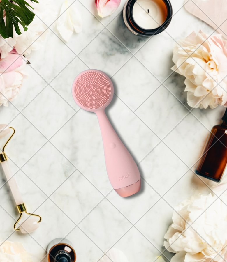 Instagram post by @glowdaily__ for PMD Beauty. Caption reads: 🌻 Lift & tone your skin with PMD Clean Pro RQ....