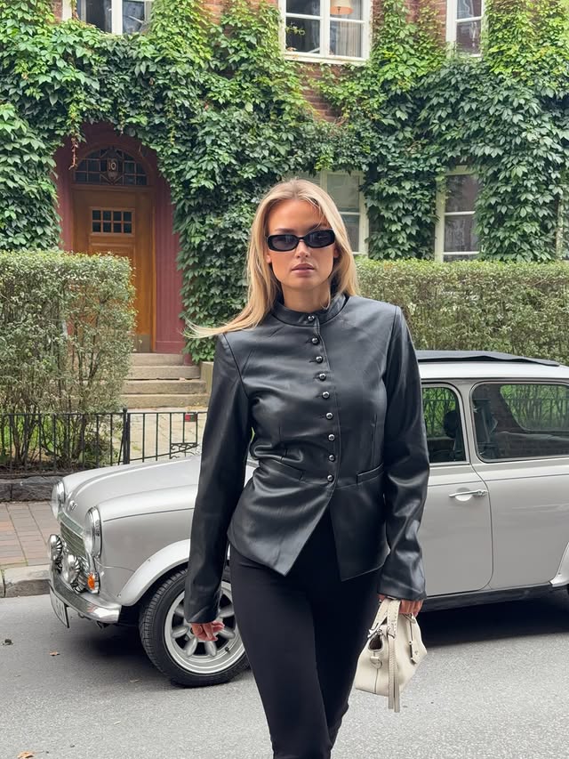 Instagram post by @emmawinterhagen for NELLY.COM. Caption reads: Advertisement @nellycom 🖤 Autumn is here and I AM....