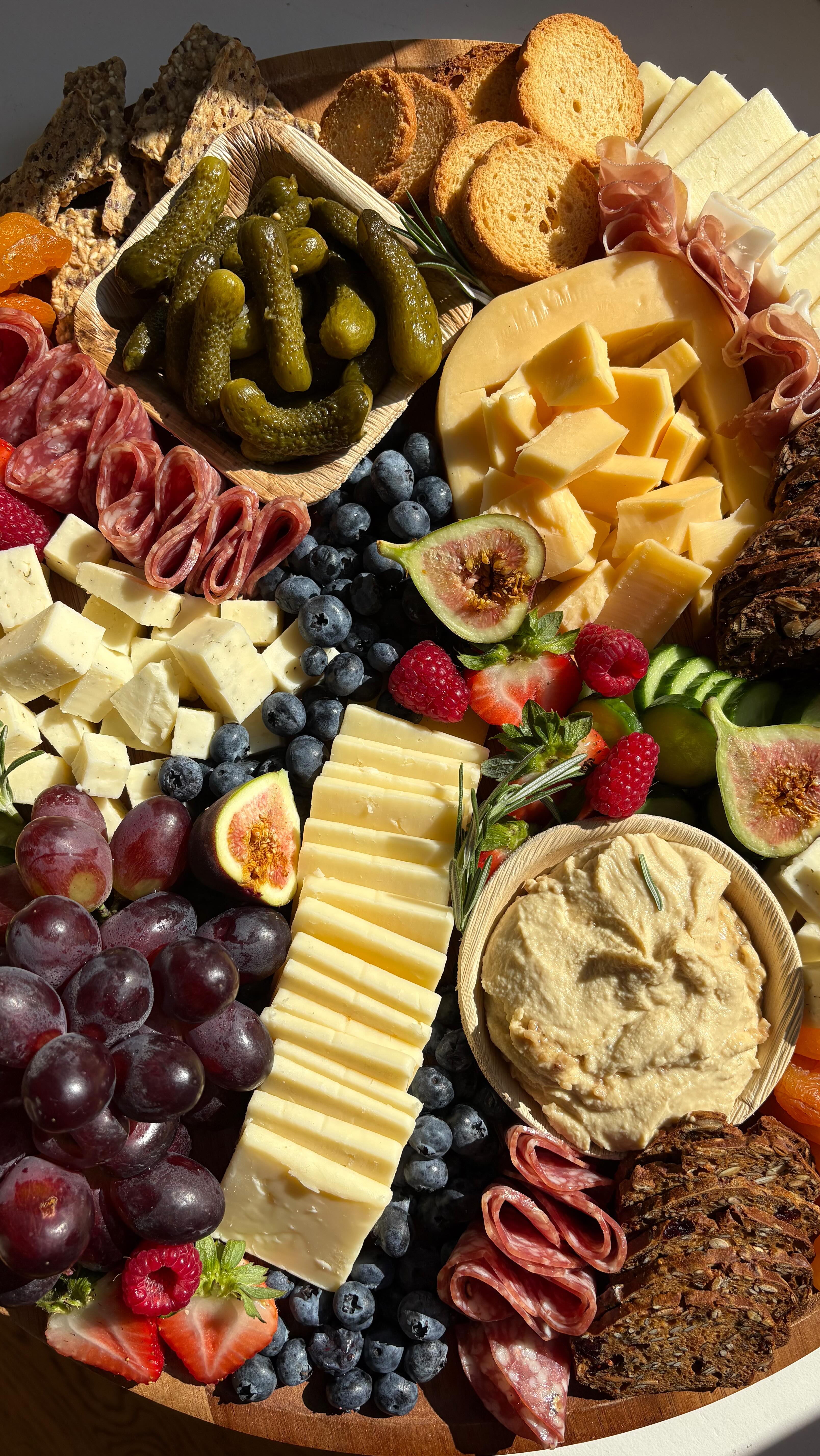 Instagram post by @ecline_eats for Fresh Thyme. Caption reads: making charcuterie is my favorite olympic sport 🥲....