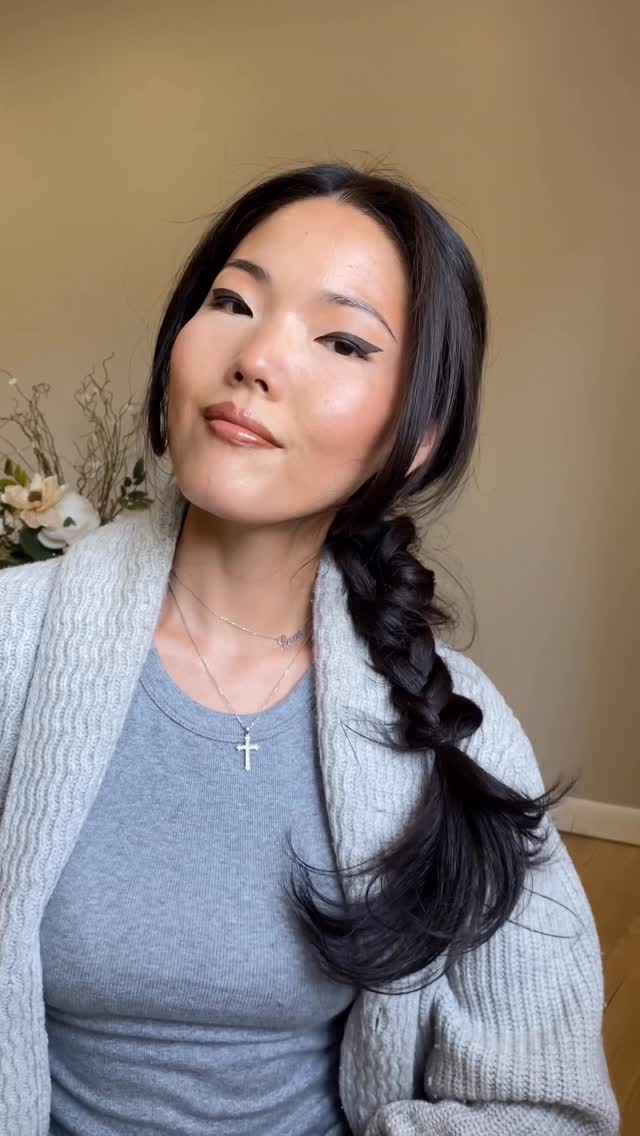 Instagram post by @alexandra.g.g.hair for Politics and Prose. Caption reads: It's all about braids and chunky sweaters this....