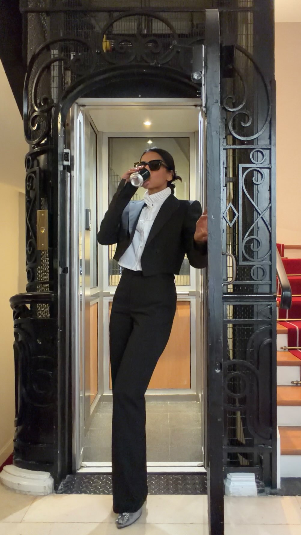 Instagram post by @sommyyah for NET-A-PORTER. Caption reads: Showing you new fall fashion trends, one elevator....