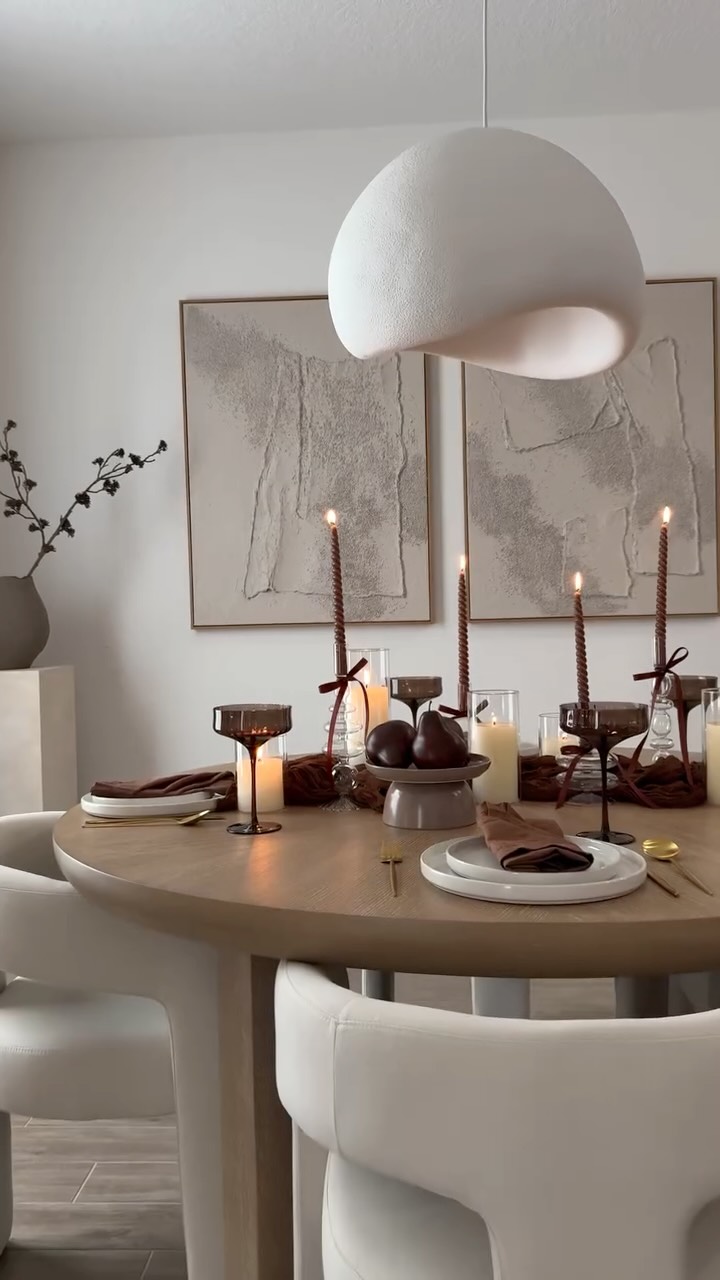 Instagram post by @lauri_b for Rooms To Go. Caption reads: Seasonal Tablescape🕯️🤎🍂— 💬Comment FALL for....