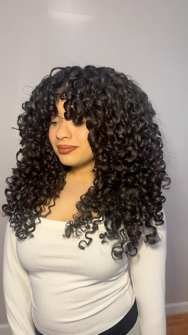 Instagram post by @curlswithalexa for CURLSMITH. Caption reads: If you’re not prioritizing your shampoo routine....