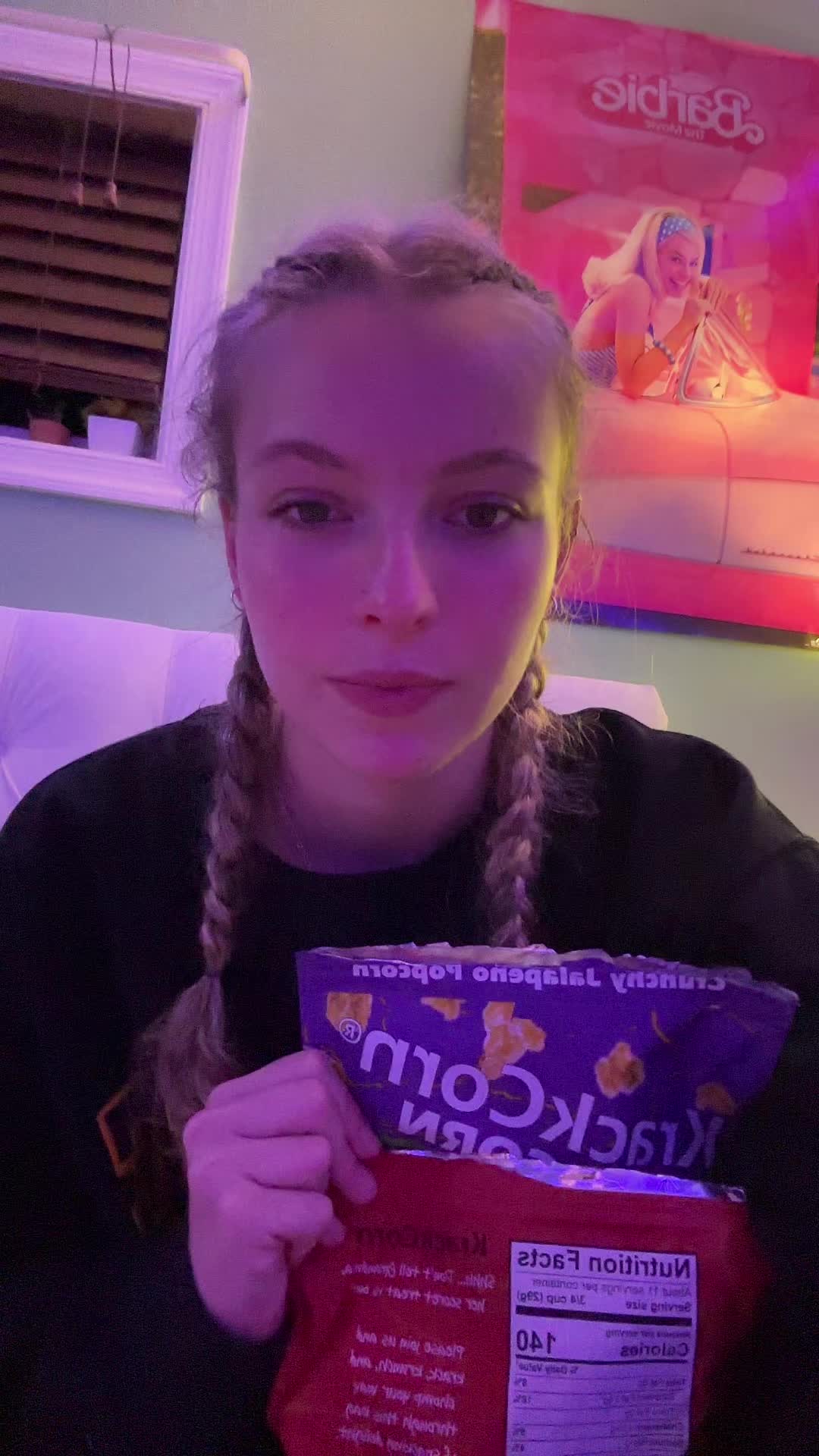 TikTok post by @reina_unger for KrackCorn Popcorn. Caption reads: I have a new favorite flavor ❤️ @KrackCorn Popcorn....