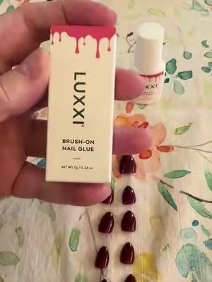 TikTok post by @scoutfin91 for Luxxi Nails. Caption reads: @LUXXI NAILS I absolutely love this press on nail....