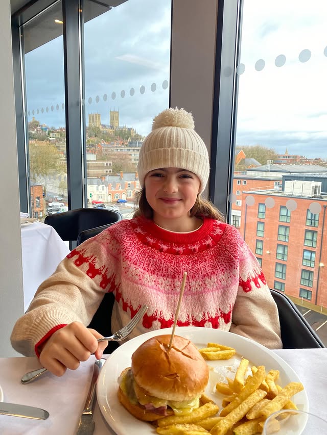 Instagram post by an influencer for DoubleTree by Hilton Lincoln. Caption reads: Ad| Stunning food with incredible views,....