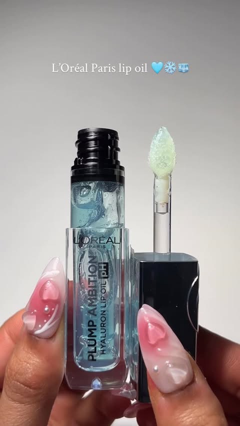 Instagram post by @sairasglam for Shoppers Drug Mart. Caption reads: Sound on 🔊🩵❄️

 @lorealparis pH lip oil....