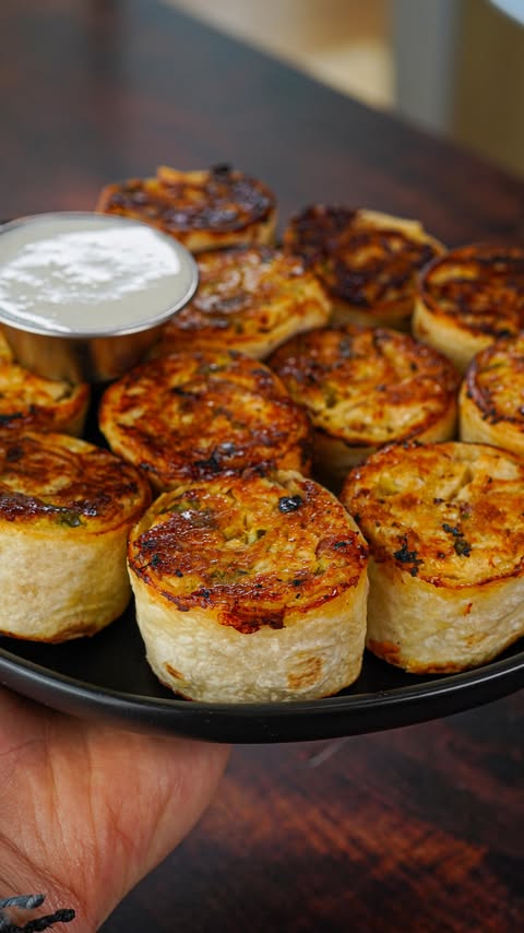 Instagram post by @theflexibledietinglifestyle for Oikos. Caption reads: [...] Chicken, Bacon, Ranch Pinwheels #ad....