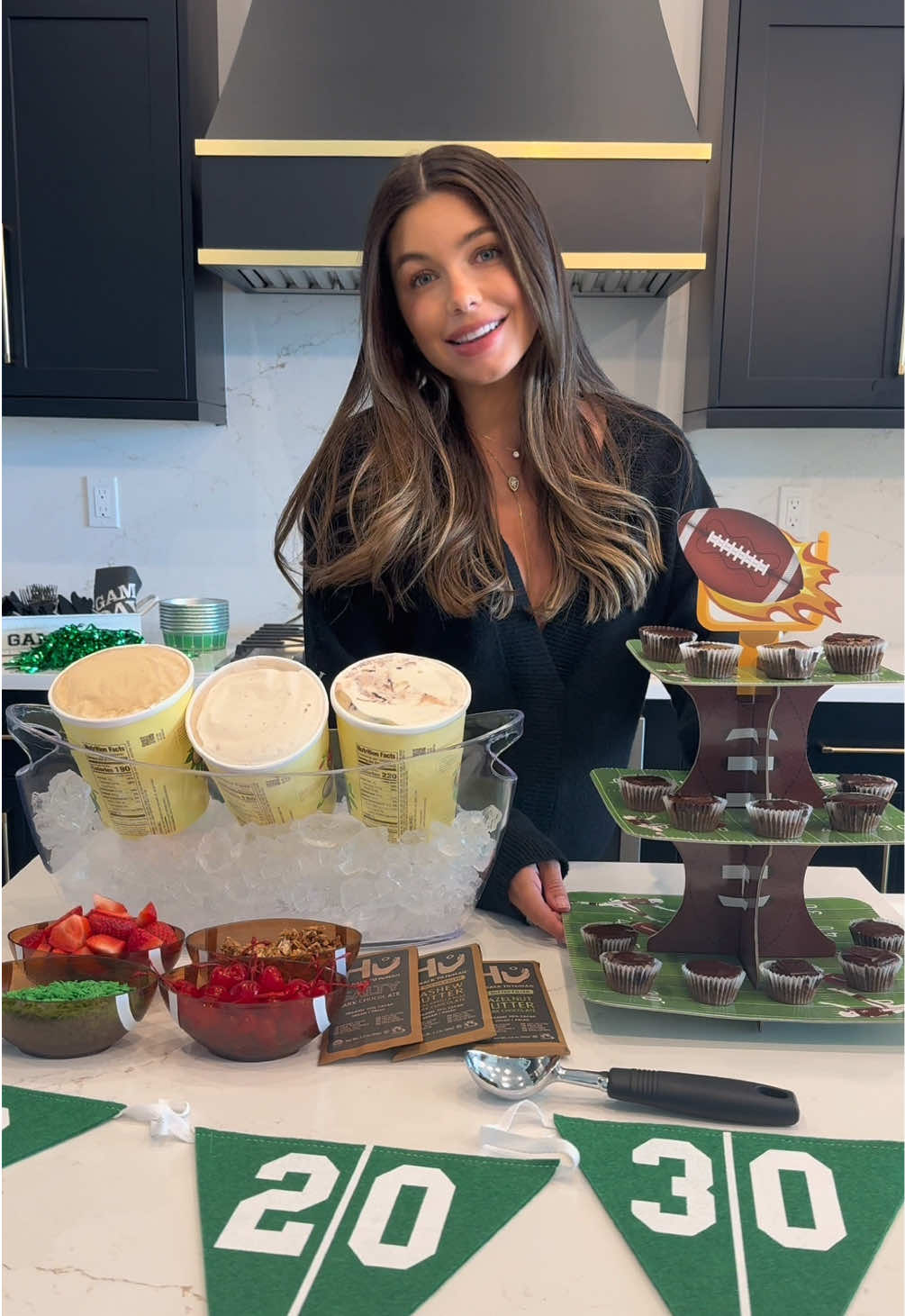 TikTok post by @hannahannsluss for Hu Kitchen. Caption reads: [...] sweeter 🍫✨ Topped my sundaes with....