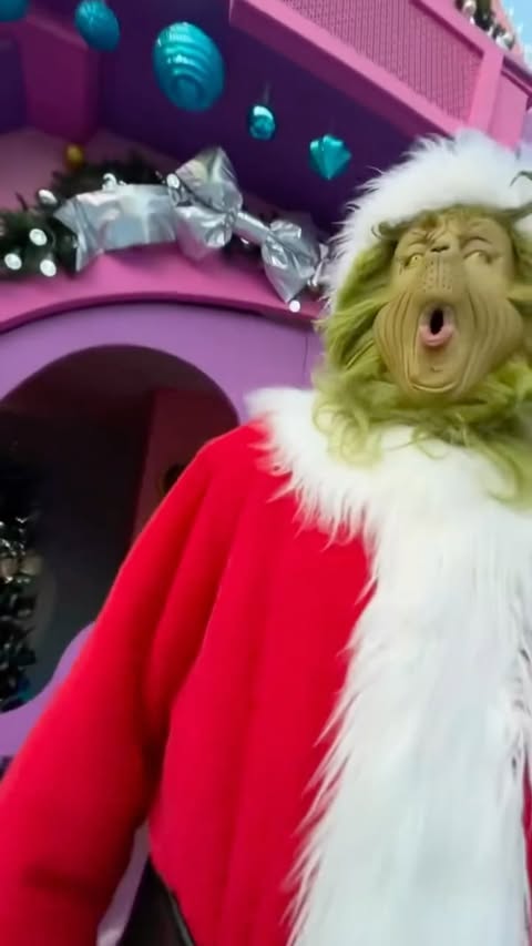 Instagram post by @kenyamlol for Universal Studios Hollywood. Caption reads: Not Mr.Grinch and Megatron beefing this year😂🫣....