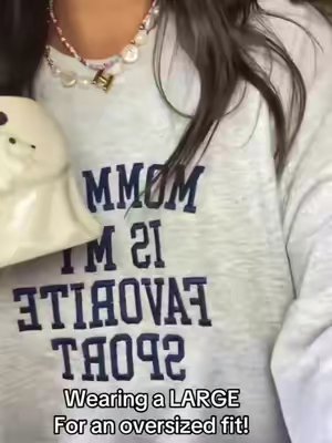 TikTok post by @mamahnc3 for United Monograms. Caption reads: [...] #mommy #crewneck #sweatshirt....