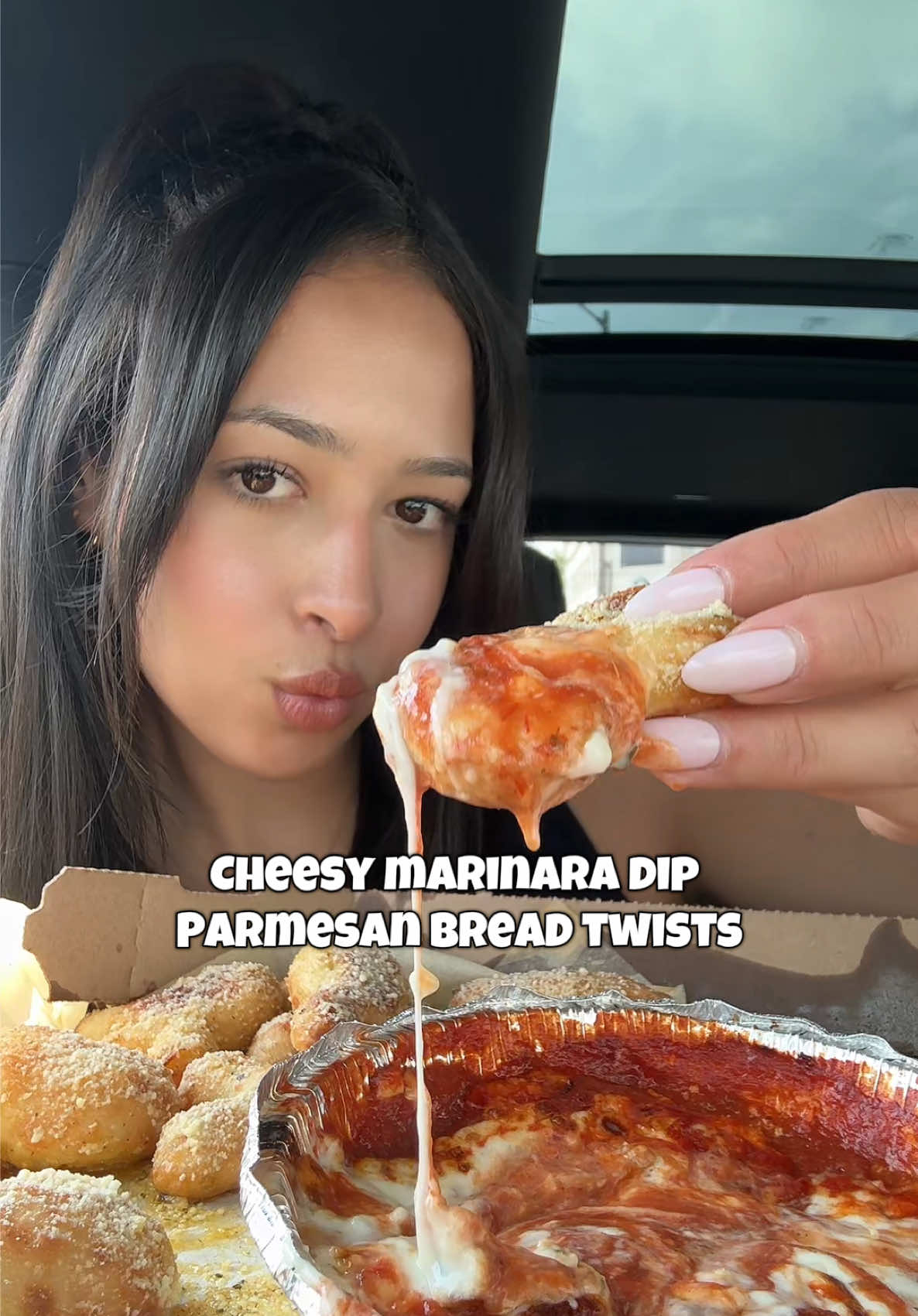 TikTok post by @sanaaeats for Domino's. Caption reads: #ad @Domino’s asmr #DominosCreatorCollective .